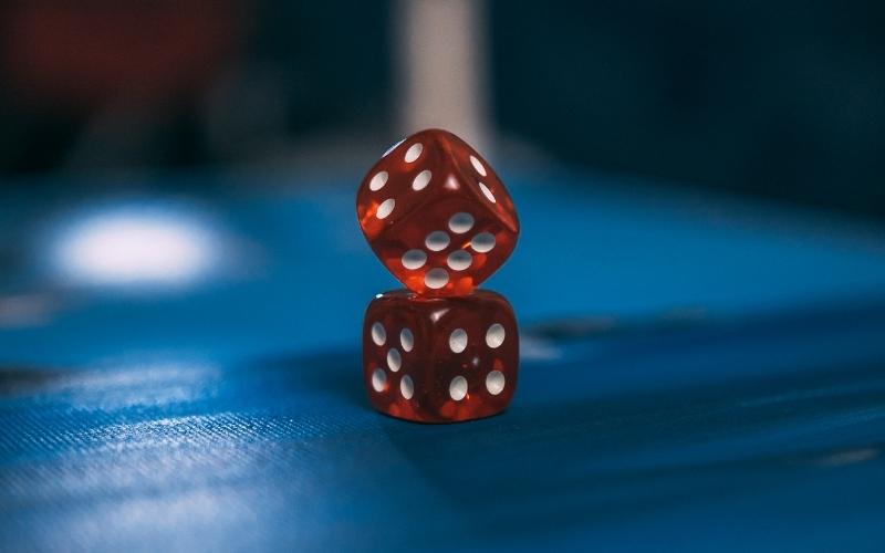 Two dice are rolled onto a casino table