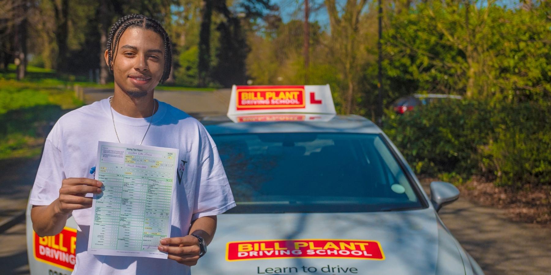 A learner driver celebrates passing their test with Bill Plant Driving School